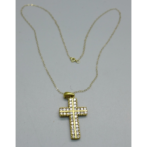 1013 - A yellow metal stone set cross pendant, tests as 9ct gold on a fine 9ct gold chain, 4.9g