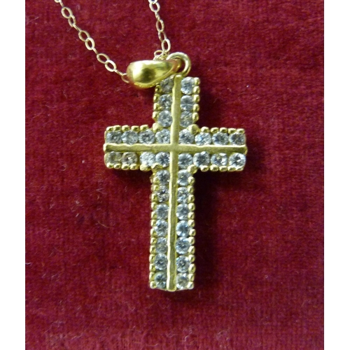 1013 - A yellow metal stone set cross pendant, tests as 9ct gold on a fine 9ct gold chain, 4.9g