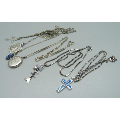 1018 - A silver locket and chain and five silver pendants and chains, 30g