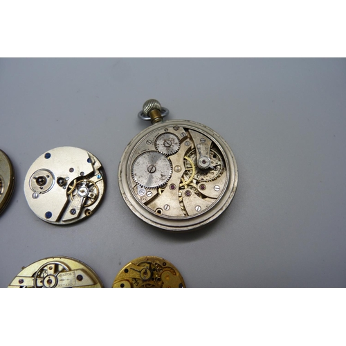 1021 - Pocket watch movements and a pocket watch with missing back, (possibly military)