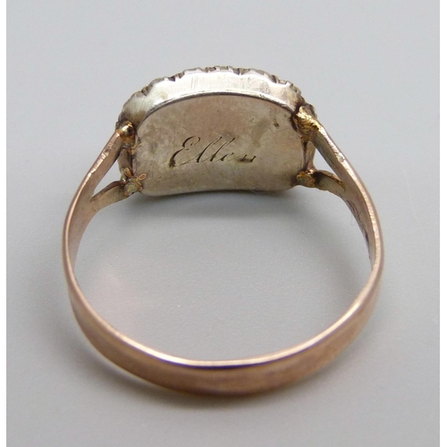 1024 - A Georgian yellow metal and pearl memorial ring, tests as gold, 2.2g, L