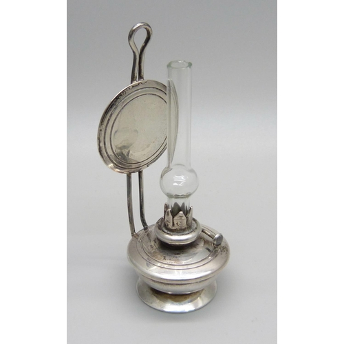 1028 - A miniature silver oil lamp, London import mark, silver weight 27g