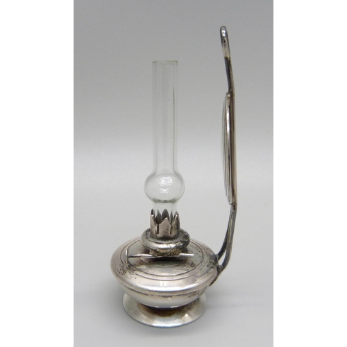 1028 - A miniature silver oil lamp, London import mark, silver weight 27g