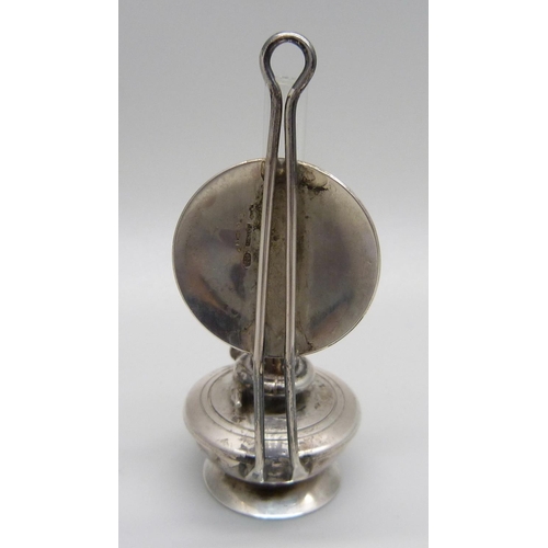 1028 - A miniature silver oil lamp, London import mark, silver weight 27g