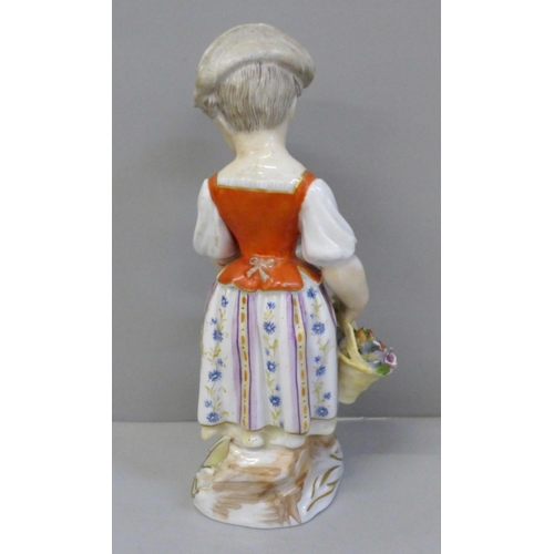 655 - A 19th Century porcelain figure of a girl holding a basket of flowers and an early 19th Century drin... 