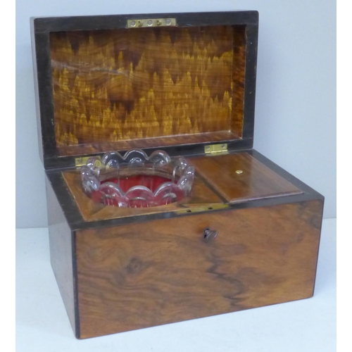 671 - A 19th Century walnut tea caddy with glass jar and key