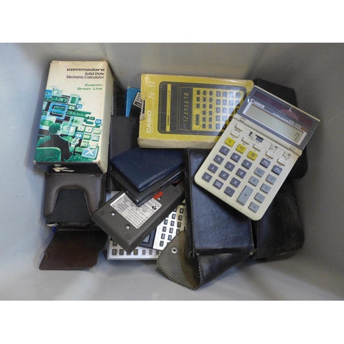 731 - A box of Casio, Commodore and other vintage calculators