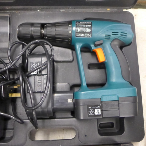 2038 - An Am-tech hammer drill and driver with battery and charger - W