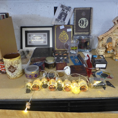 2077 - A Harry Potter bundle; mugs, wands, hair clips, playing cards, string lights, sorting hat and a stic... 