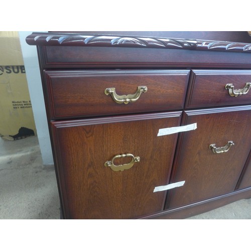 1587 - A mahogany three drawer and three door sideboard, sofa and cabinet