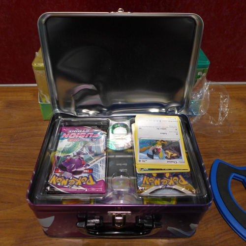 3116 - Pokemon Stacking Tins, Pokemon Chest & Case 5 Boosters  (302-235,236)  * This lot is subject to vat