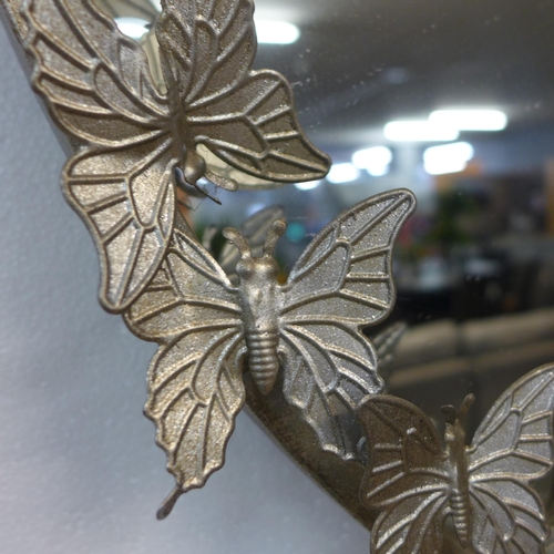 1341 - A silver circular butterfly mirror