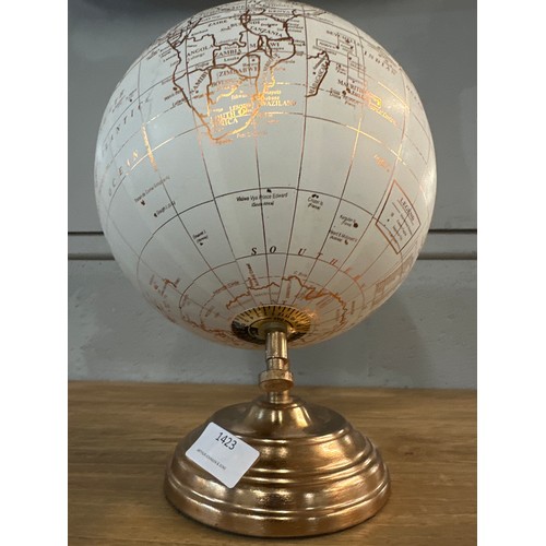 1423 - A rose gold effect desktop globe