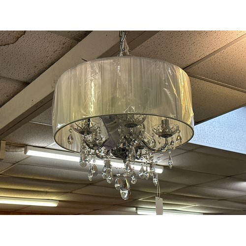 1496 - A chrome five arm chandelier with white shade