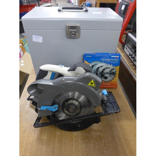 2023 - A Macallister MSCS1200 circular saw with two unused blades in metal case - W