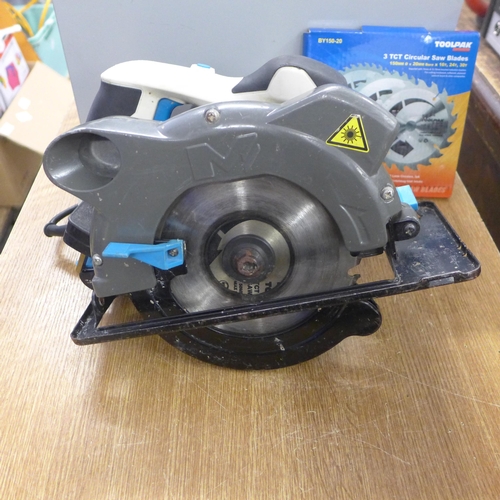 2023 - A Macallister MSCS1200 circular saw with two unused blades in metal case - W