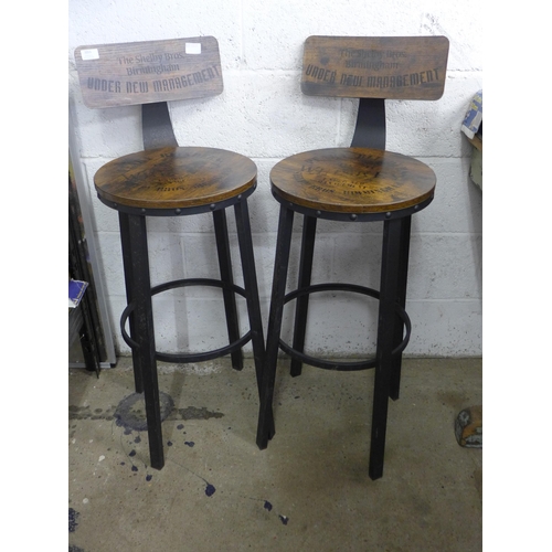 2055 - Two bar stools with 'The Shelby Bros. Birmingham, Under New Management' design on backrest