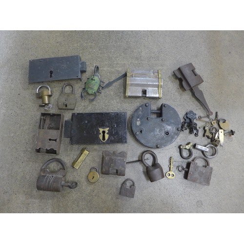 717 - A collection of locks including Indian, Tibetan, three puzzle locks, etc.