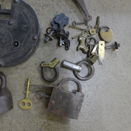 717 - A collection of locks including Indian, Tibetan, three puzzle locks, etc.