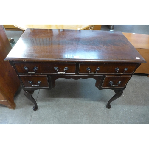 122 - A George III style mahogany writing table