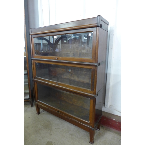 123 - An early 20th Century Globe Wernicke mahogany three tier sectional stacking bookcase