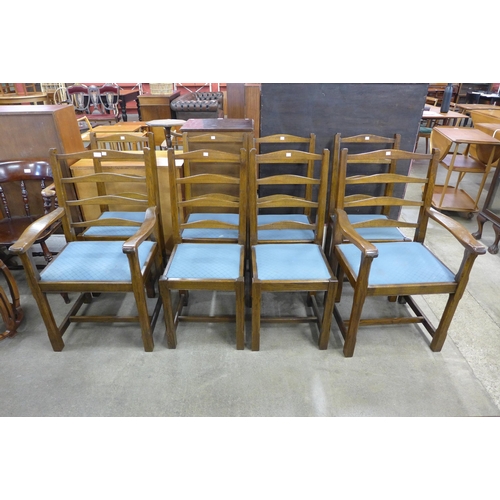 136 - A set of eight Cotswold style elm dining chairs