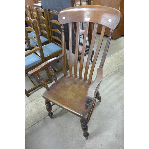 138 - A Victorian mahogany kitchen elbow chair