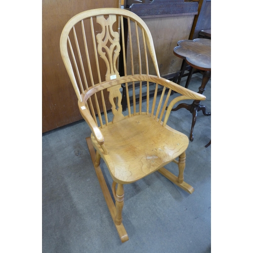 142 - A 19th Century style ash Windsor rocking chair