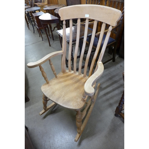 149 - A Victorian style beech farmhouse rocking chair