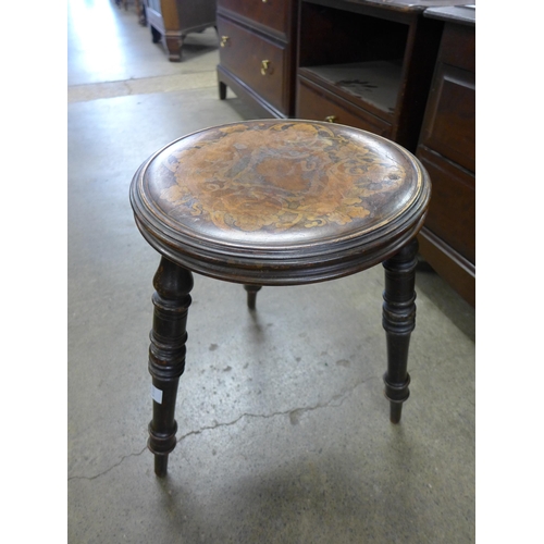 172 - An Arts and Crafts painted beech three legged stool