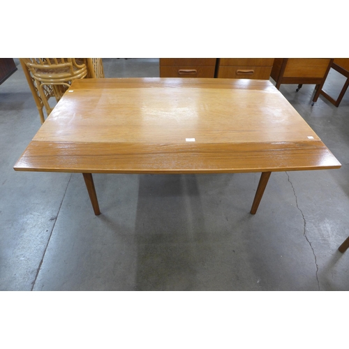 20 - A Danish teak metamorphic dining/coffee table