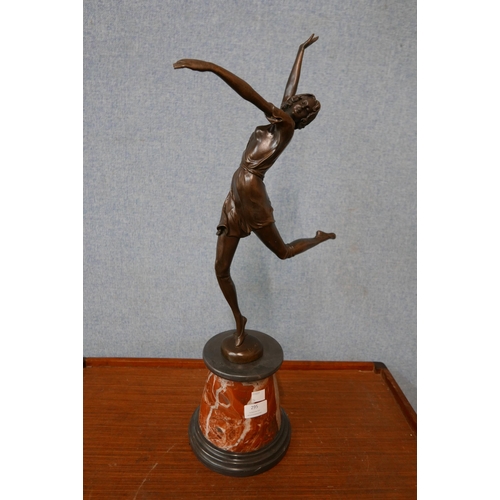 295 - An Art Deco style bronze figure of a female dancer, on rouge marble socle