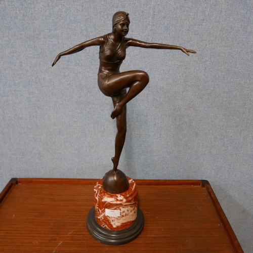 296 - An Art Deco style bronze figure of a female dancer, on rouge marble socle