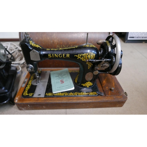 302 - A cased Singer sewing machine and one other