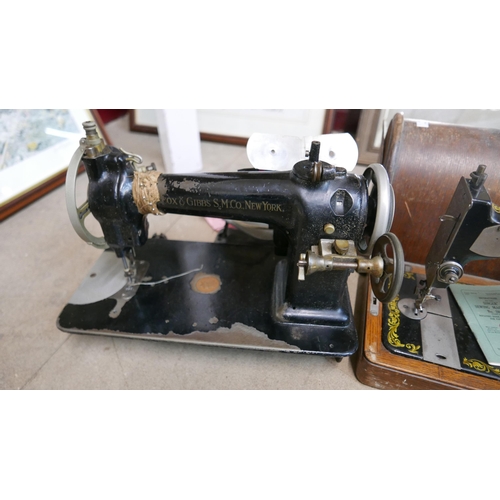 302 - A cased Singer sewing machine and one other