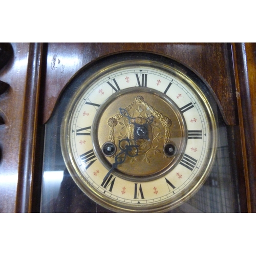 314 - A 19th Century walnut Vienna wall clock