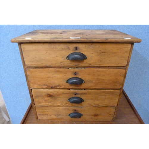 318 - A Victorian pine four drawer table top chest