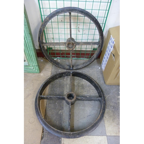 320 - Two cast iron industrial wheels