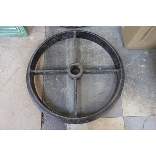 320 - Two cast iron industrial wheels