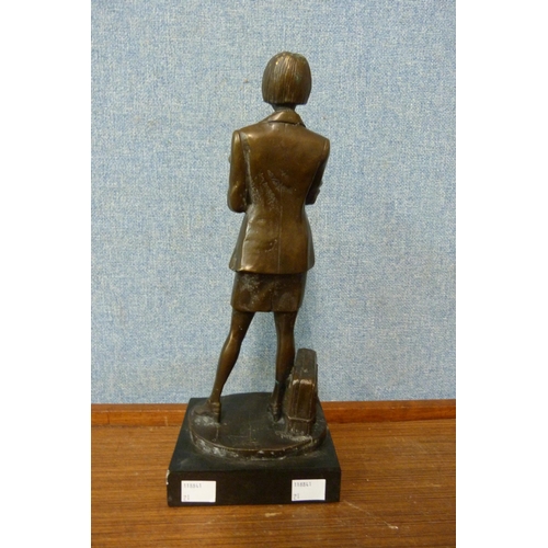 324 - A bronze figure of a female librarian