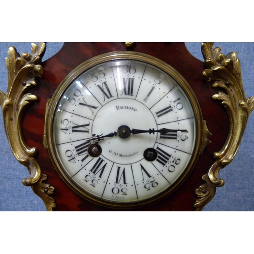 340 - An early 20th Century French faux tortoiseshell and gilt metal mounted mantel clock