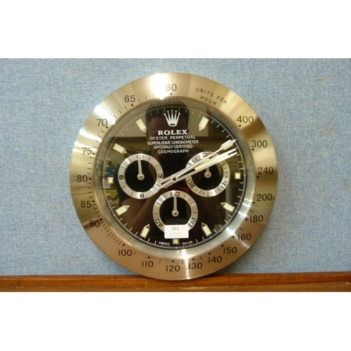 343 - A Rolex style dealer's display wall clock