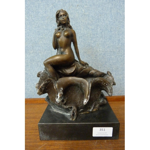 351 - An Art Deco style bronze figure of a female nude sat on a conch shell, on black marble socle