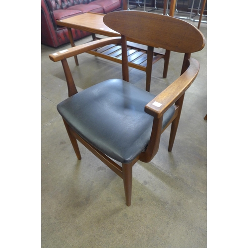 4 - A pair of Danish team and black vinyl elbow chairs