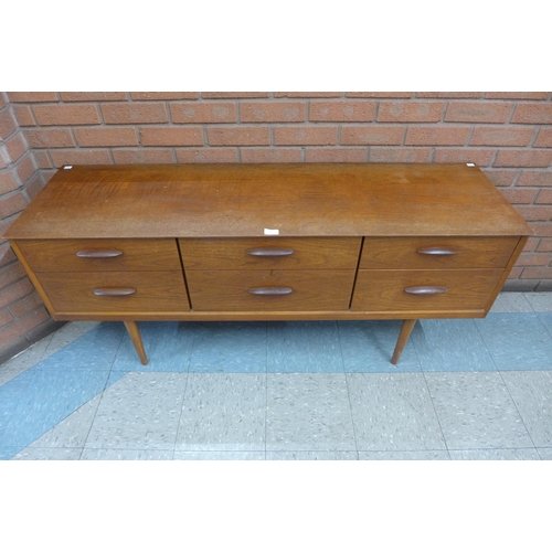 46 - An Austin Suite teak six drawer sideboard