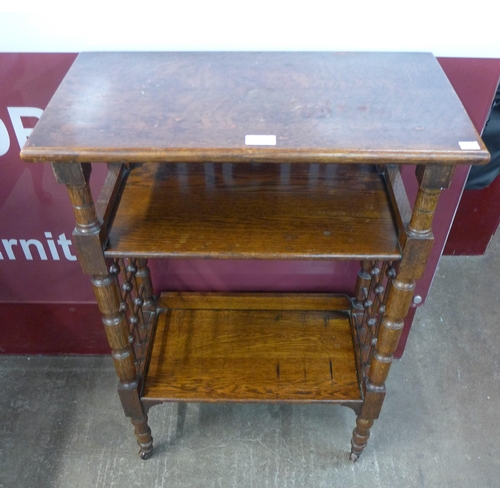 89 - An Arts and Crafts Liberty & Co. oak reading stand, designed by Leonard Wyburd