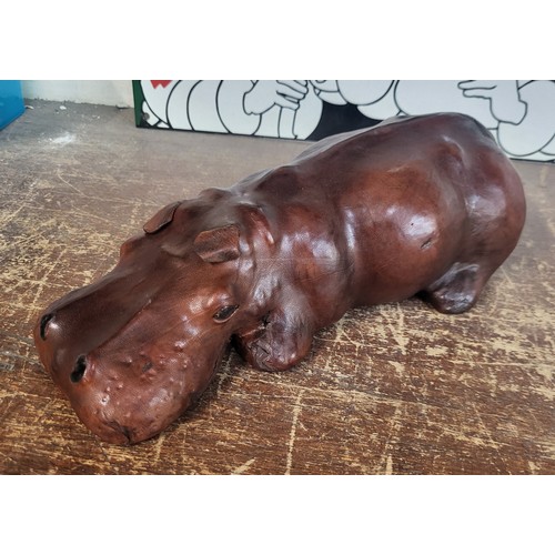 307 - A small brown leather hippopotamus