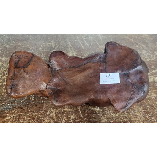 307 - A small brown leather hippopotamus