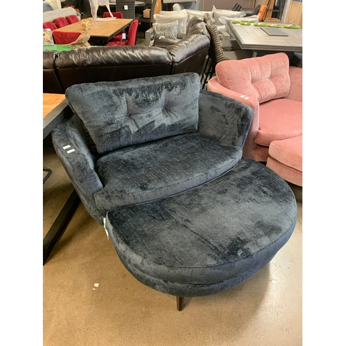 1307 - A large black velvet buttoned back love seat with footstool