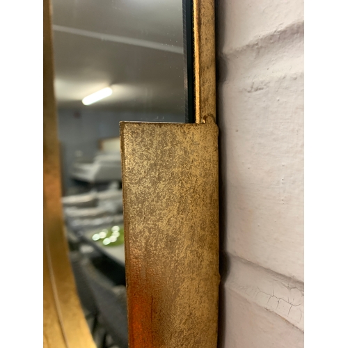 1410 - A gold pill shaped mirror